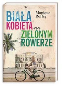 Biała kobieta na zielonym rowerze