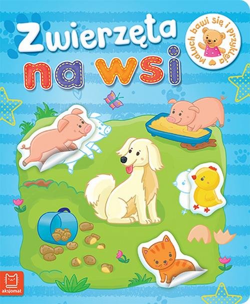 Maluch bawi się i przykleja Zwierzęta na wsi